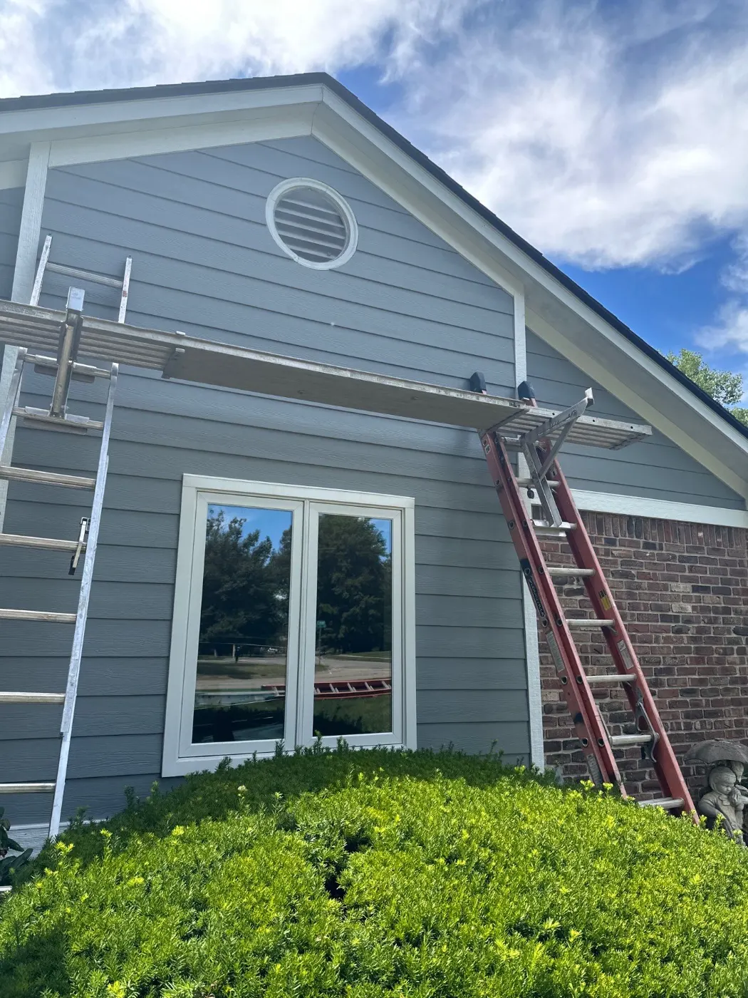Siding installation documented in Center Grove